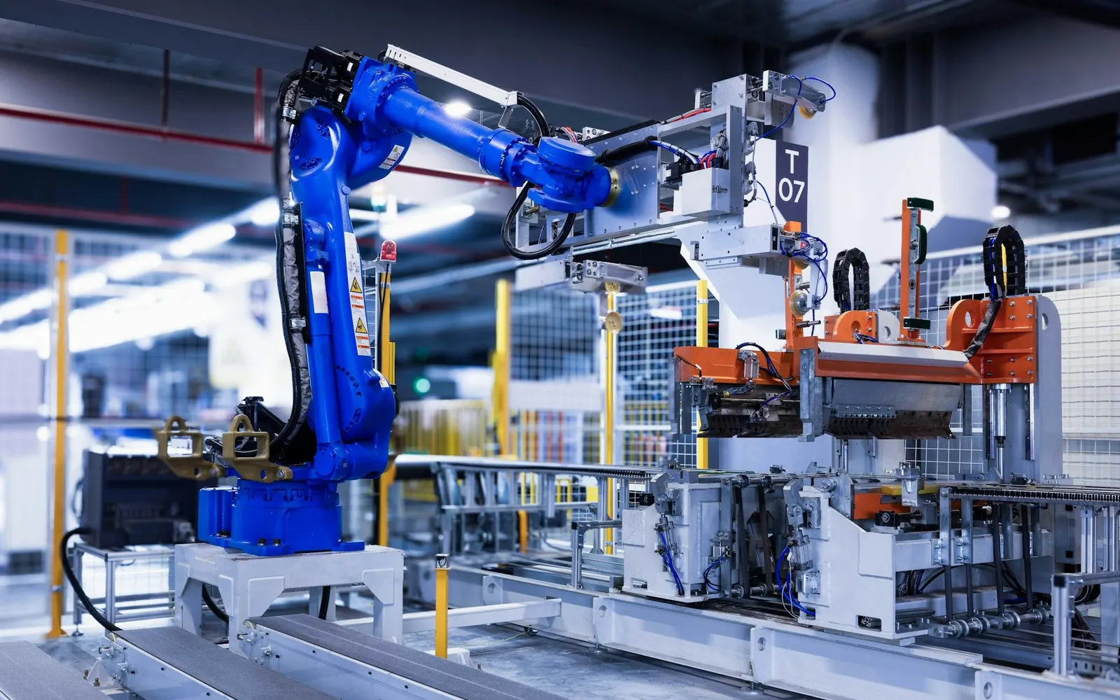 A robotic arm working on an automated factory production line