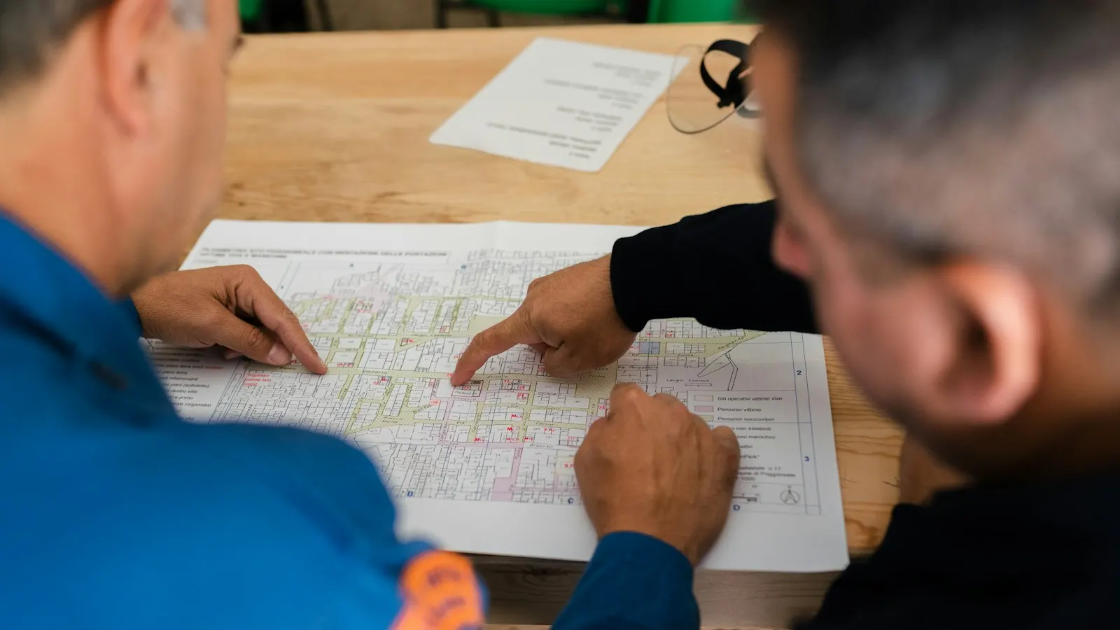 Engineers reviewing drawings together at a desk