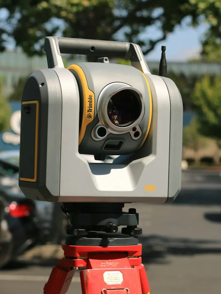 Survey scanner on a tripod capturing an existing site