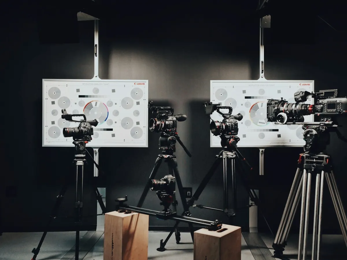 Cinema cameras on tripods in a studio