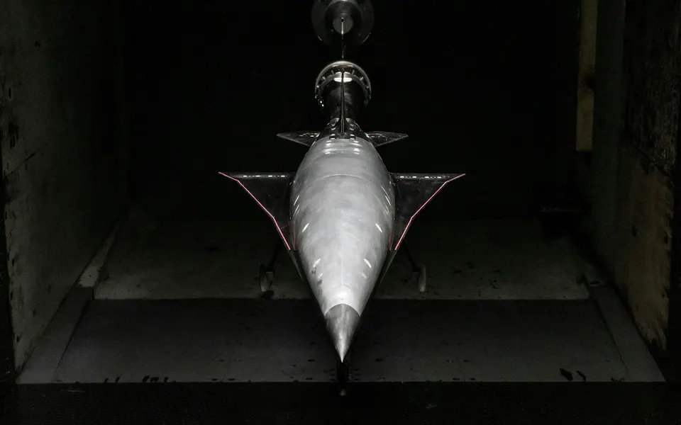 An aircraft model mounted in a wind tunnel